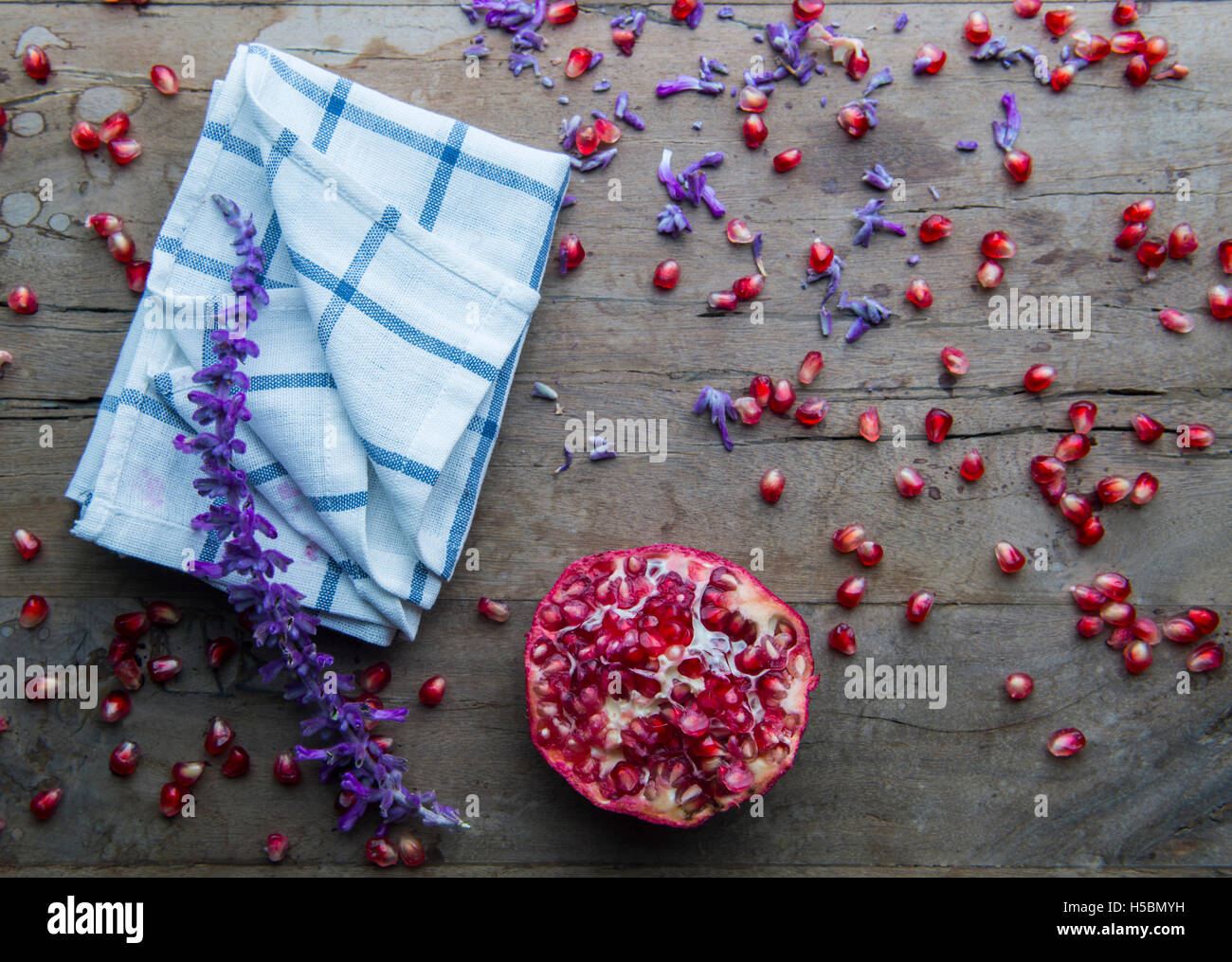 lavender leaf and pomegranate on a wooden table Stock Photo