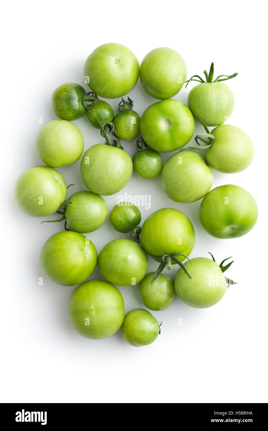 Unripe green tomatoes isolated on white background. Top view Stock ...