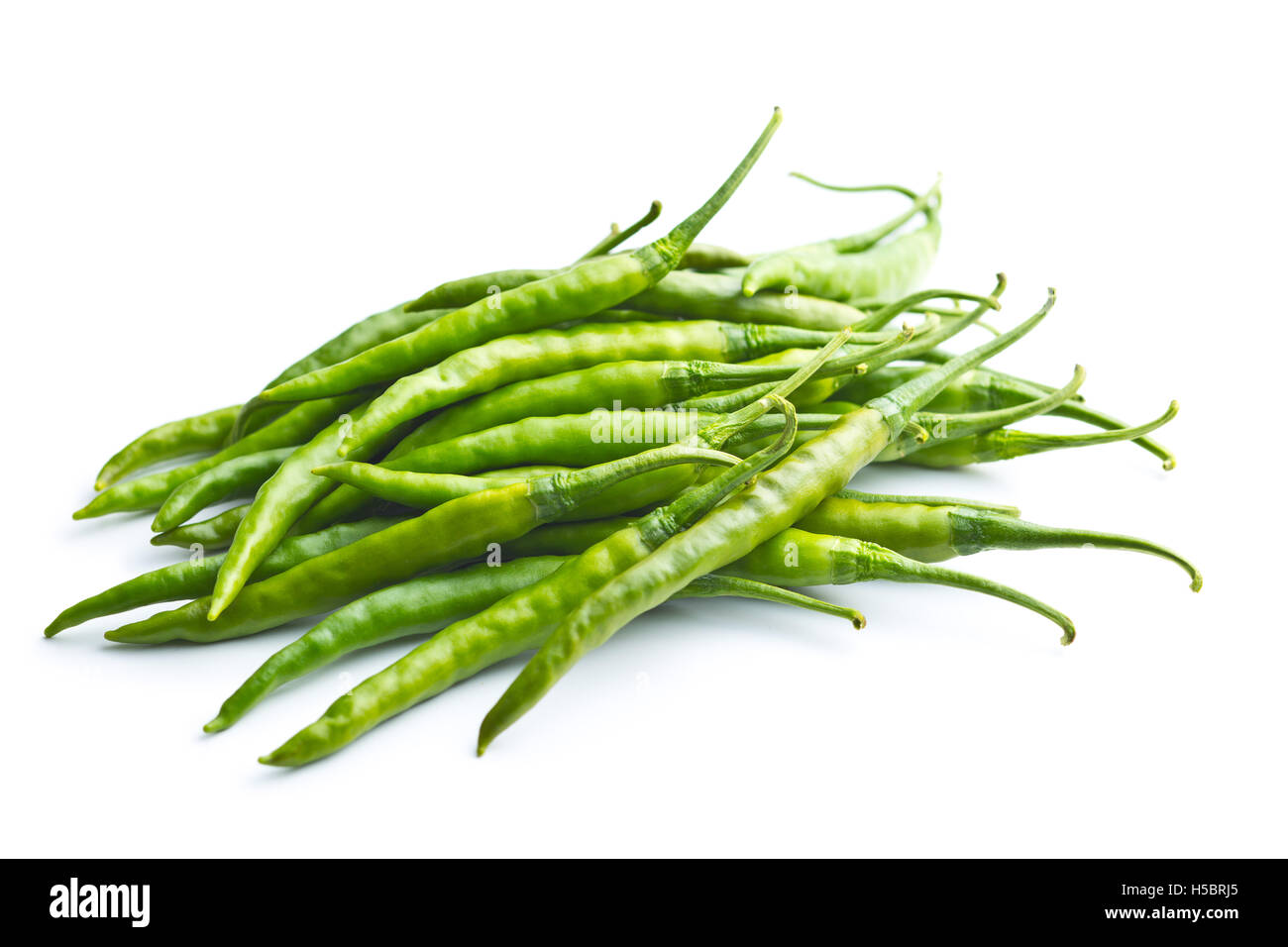 Green chili peppers isolated on white background Stock Photo - Alamy