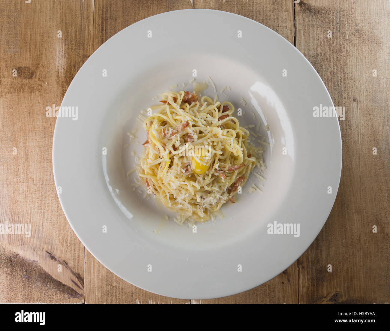 pasta bolognese in plate on wooden background. Stock Photo