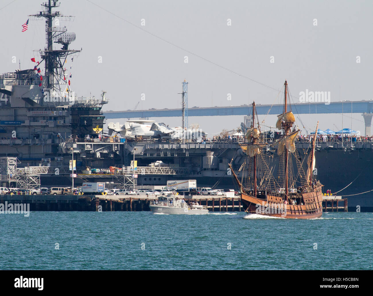 Tall ship San Salvador with USS Midway in background during 2016 Festival of Sail, Parade of Ships, San Diego Bay, CA Stock Photo