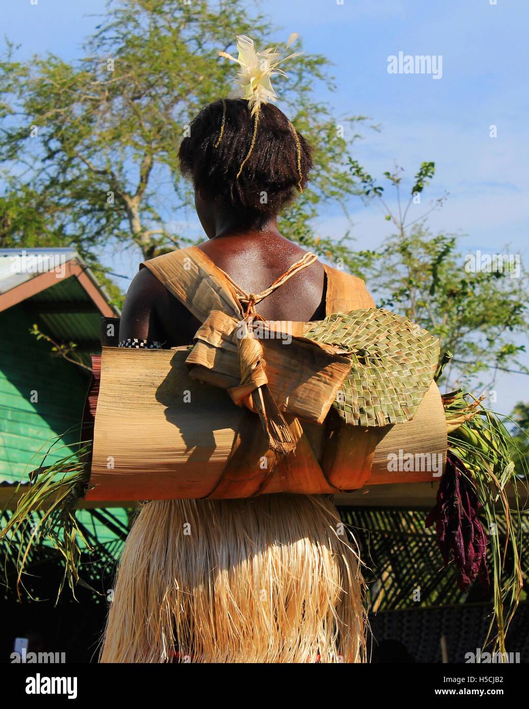 Young Bougainville Model showcasing Bougainville Traditional way of carrying things by women. Stock Photo
