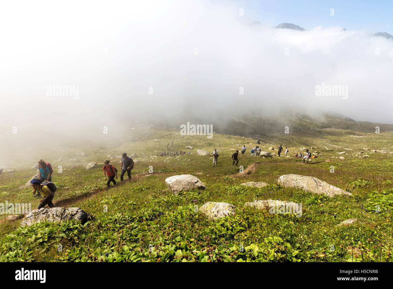 A group of hikers climbs along the trail in the Kackar mountains Stock Photo