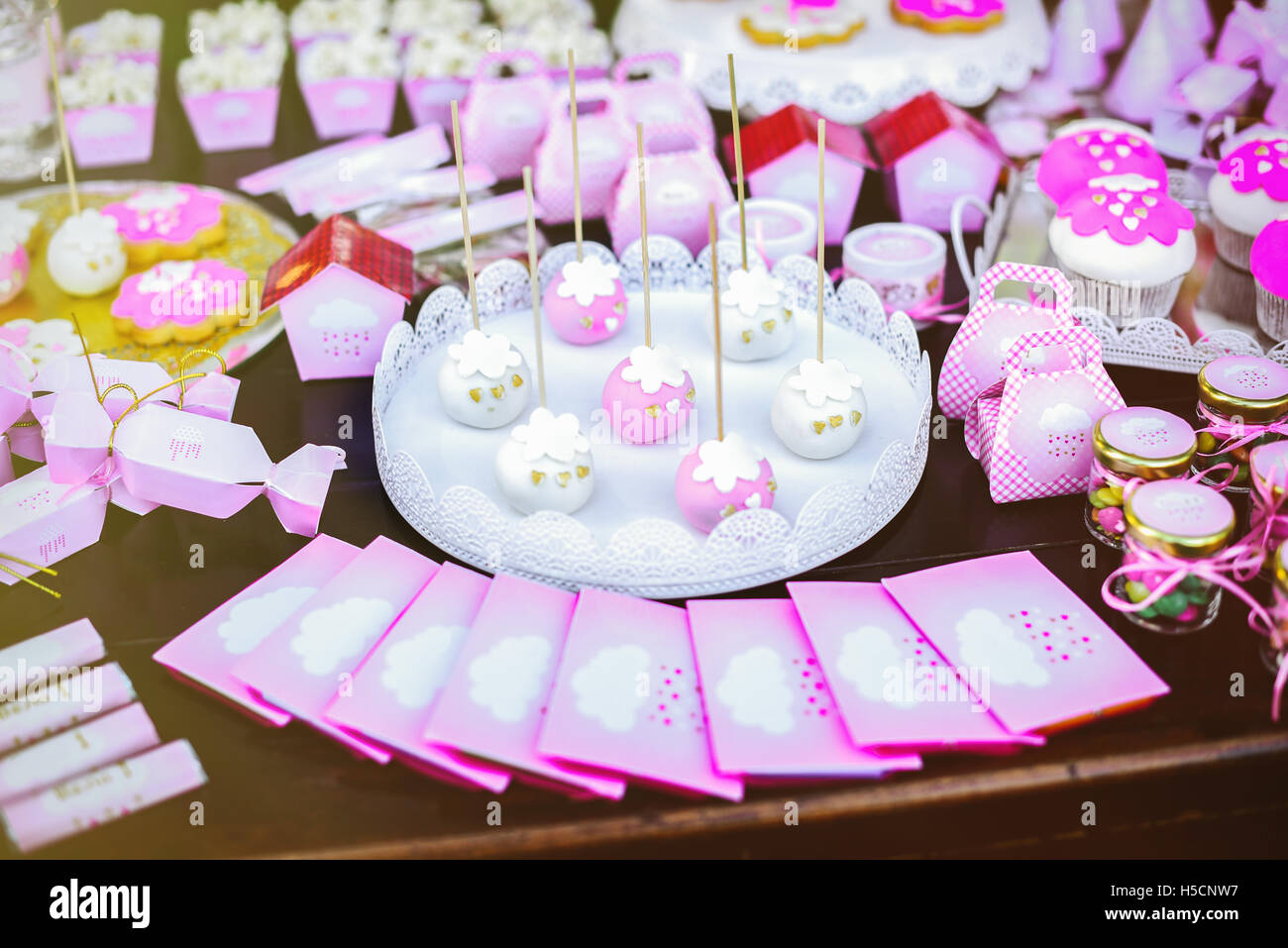 Dessert table at kids birthday party. Cake, candies, marshmallows