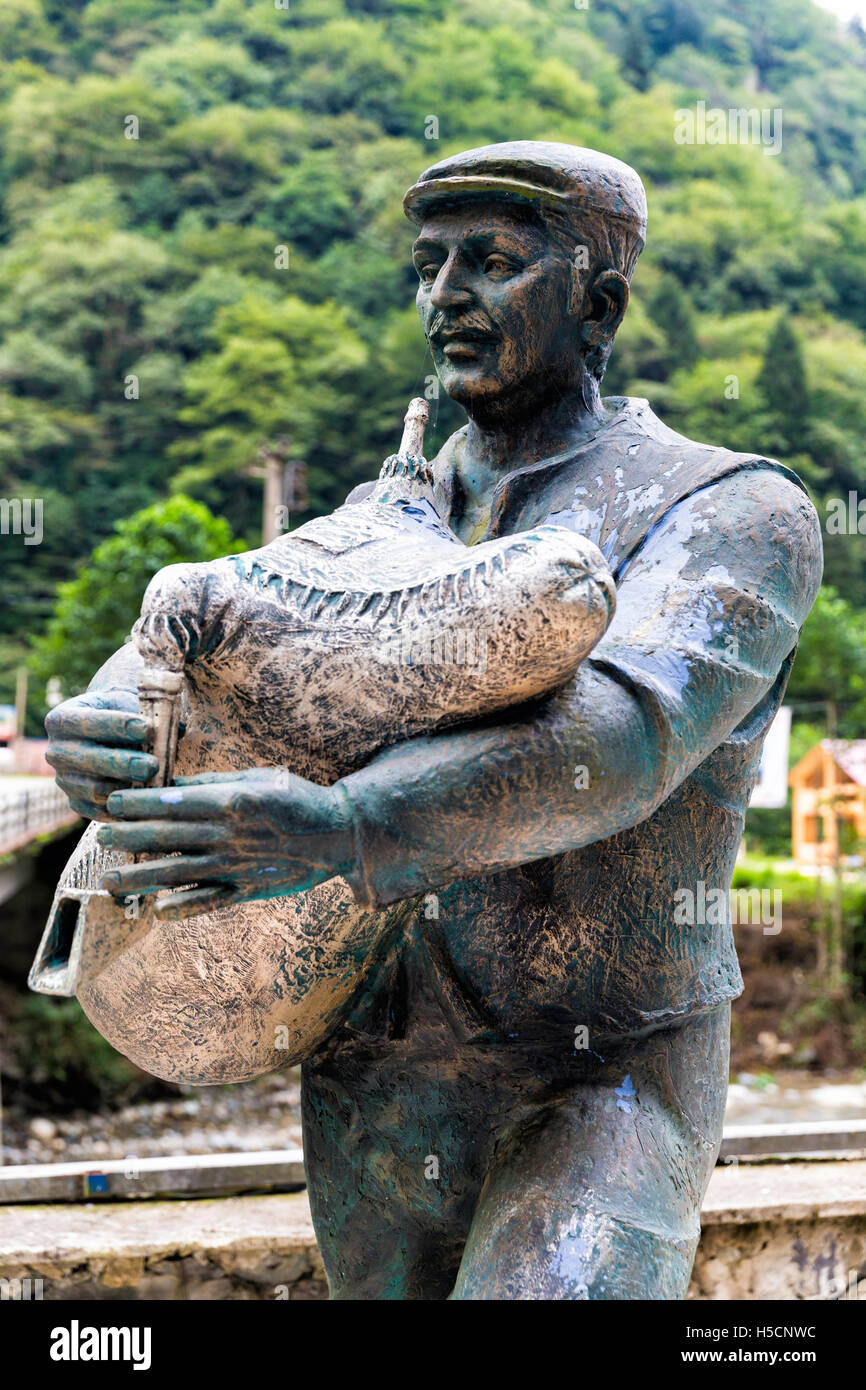 Piper bronze statue playing bagpipe made by sculptor Kadir Genc, Turkish: Tulum. Stock Photo