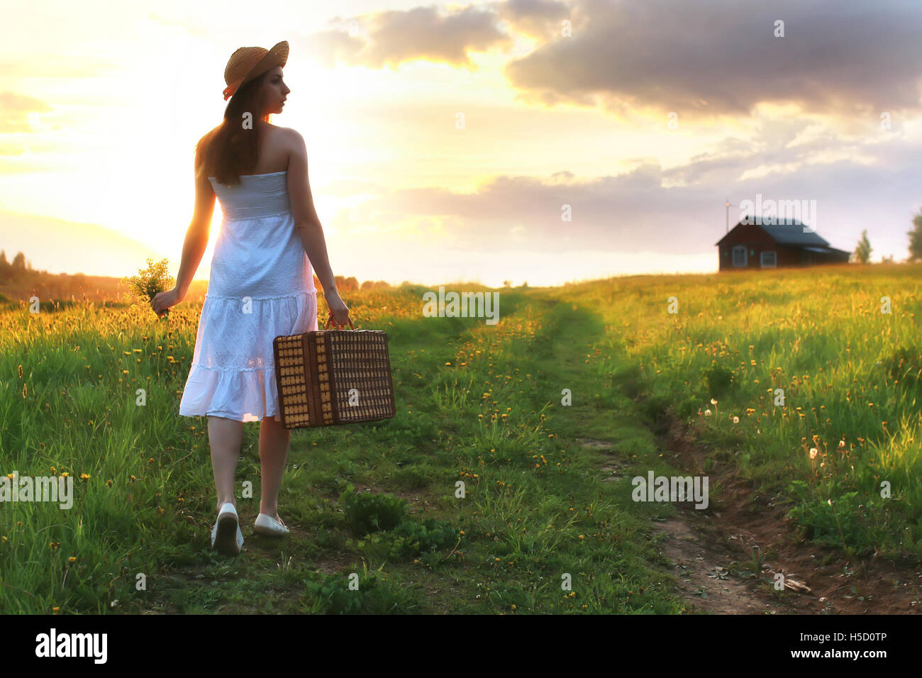 girl at sunset field Stock Photo - Alamy