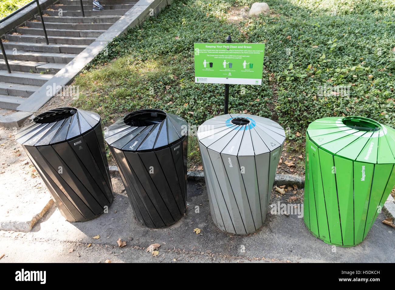 Garbage, recycle bins along the sidewalk on the streets of New York