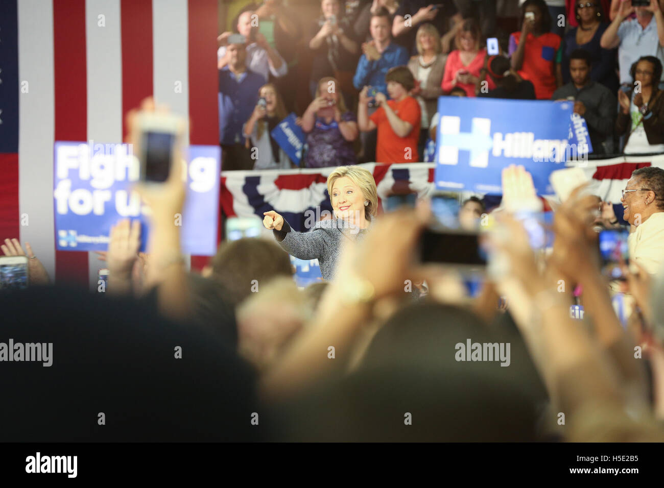 Hillary Clinton arrives to a standing audience at a rally to campaign ...