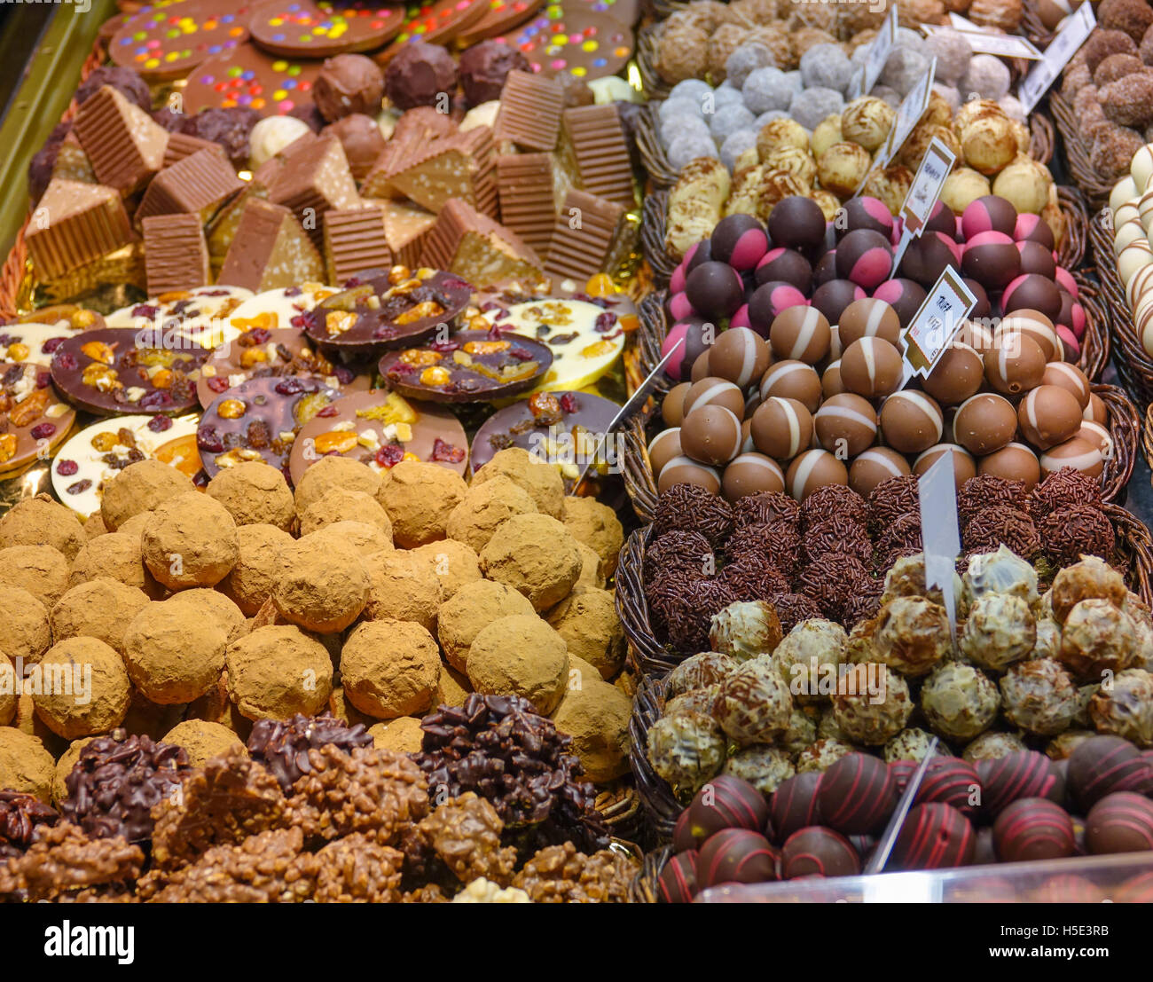 Sweets truffles and pralines variety of chocolates on a market Stock