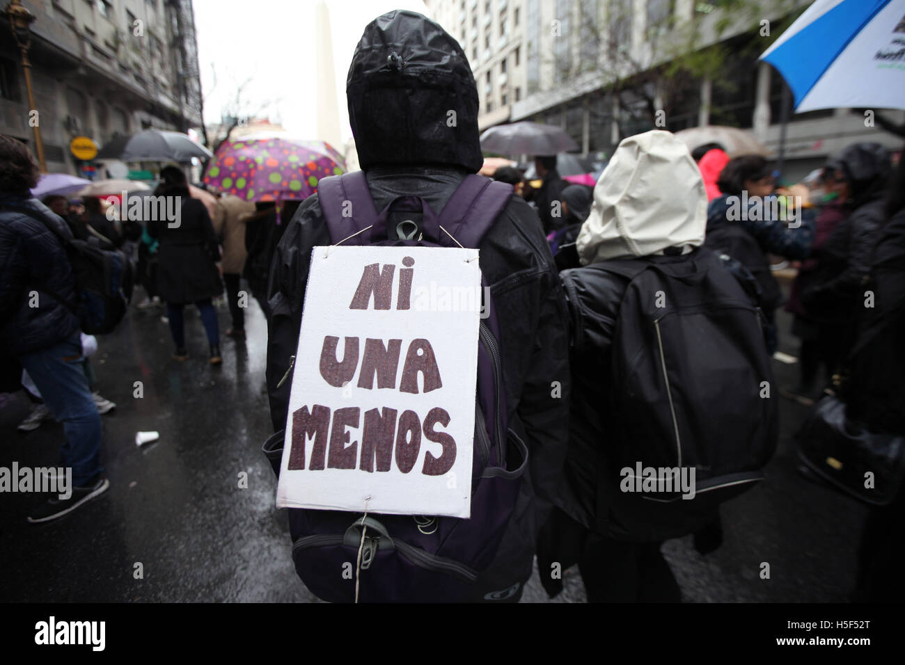 Buenos Aires, Buenos Aires, Argentina. 19th Oct, 2016. Gathering under the slogan Ni Una Menos ('Not one less'') and spurred by the brutal murder of 16-year-old LucÃa Pérez in Mar del Plata last week, hundreds of thousands of women across Argentina yesterday protested against gender violence and femicide in mass rallies across many cities, including Buenos Aires City, where demonstrators shrugged off heavy rain to march dressed in black from the Obelisk to the Plaza de Mayo. © Claudio Santisteban/ZUMA Wire/Alamy Live News Stock Photo