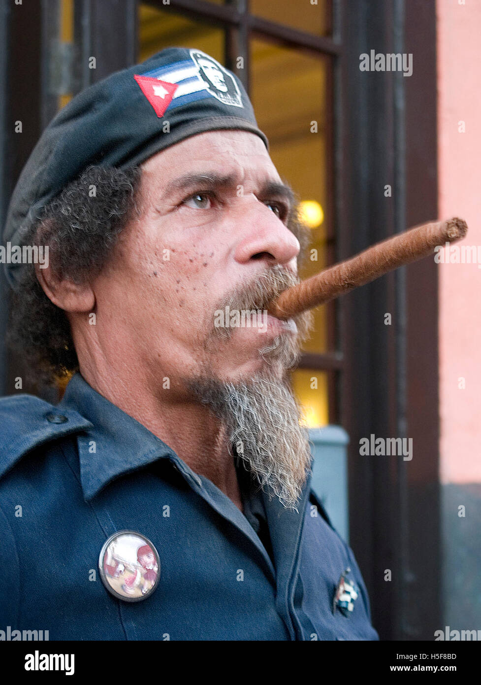 Mar 28, 2006 - Havana, CUBA - Che Guevara impersonator with cuban cigar. The Republic of Cuba is located in the northern Caribbean and south of the United States. The first European to visit Cuba was explorer Christopher Columbus in 1492. Centuries of colonial rule and revolutions followed. Batista was deposed by Fidel Castro and Che guevara in 1953. After the revolution trade with comminist Russia grew. The economy was hit hard in the 1990s following the collapse of the Soviet Union. Cuba currently trades with almost every nation in the world, albeit with restrictions from the U.S. embargo. T Stock Photo