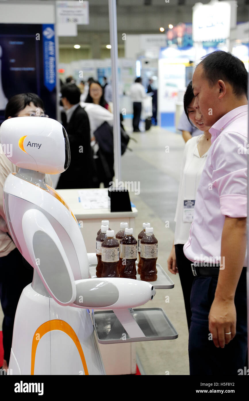 A robot waiter offers drinks to visitors during the Japan Robot Week 2016 in Tokyo Big Sight on October 20, 2016, Tokyo, Japan. Japan Robot Week is a trade show focusing on service robots and the latest technologies and components. 7th Robot Award ceremony and exhibitions will be held at the event which runs from October 19-21. © Rodrigo Reyes Marin/AFLO/Alamy Live News Stock Photo