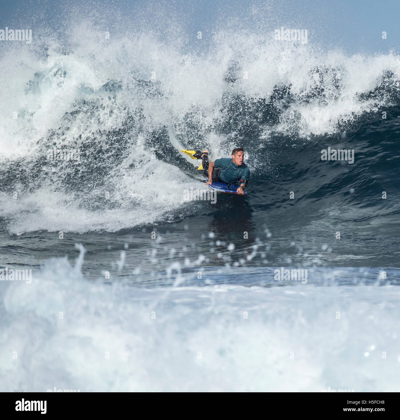 Las Palmas, Gran Canaria, Canary Islands, Spain. 21st October, 2016. Weather: A Bodyboarder rides a huge wave on the rocky north coast of Gran Canaria, with morning temperatures in the mid to high 20`s Celcius on a glorious Friday in the Canary Islands Credit:  Alan Dawson News/Alamy Live News Stock Photo