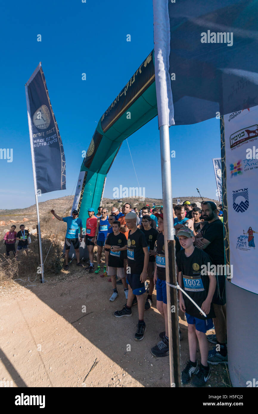 Shiloh, Israel. 21st October, 2016. Runners prepare to run the 10KM section of the 2016 Bible Marathon at Shiloh, believed to be the site of the Biblical Tabernacle. The visitor Center can be seen in the background on the hill. Credit:  Yagil Henkin/Alamy Live News Stock Photo