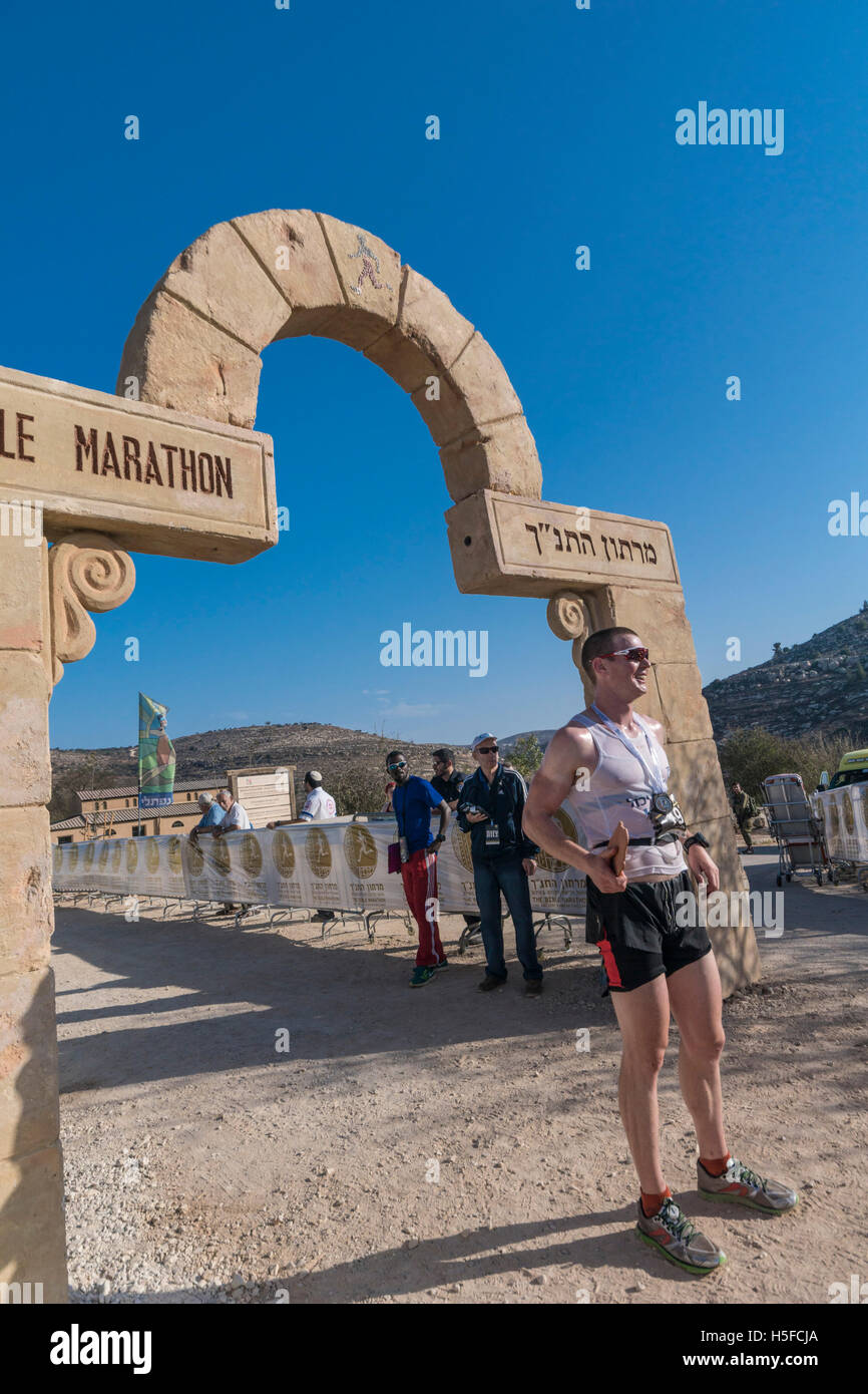 Shiloh, Israel. 21st October, 2016. Yaniv Levi, 4th place in the 2016 Bible Marathon at Shiloh, the place of the biblical tabernacle, crosses the finish line after running 42.2 KM from the town of Rosh Haayin. Credit:  Yagil Henkin/Alamy Live News Stock Photo