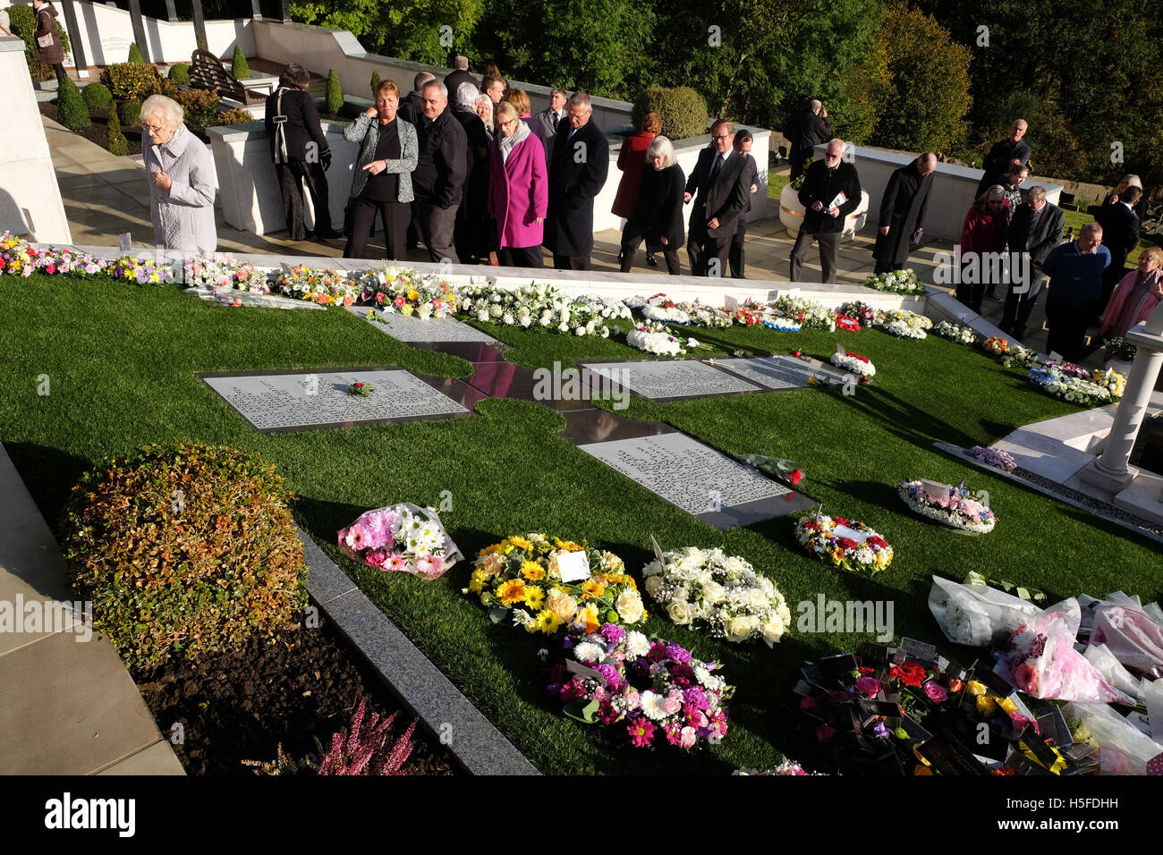 Aberfan, Wales - Friday 21st October 2016 - Relatives and villagers attend the cemetery in Aberfan to mark the 50th Anniversary of the terrible tragedy that took place on 21st October 1966. 144 people including 116 young children were killed when a mountain of coal waste slid down into the village and school. Credit:  Steven May/Alamy Live News Stock Photo