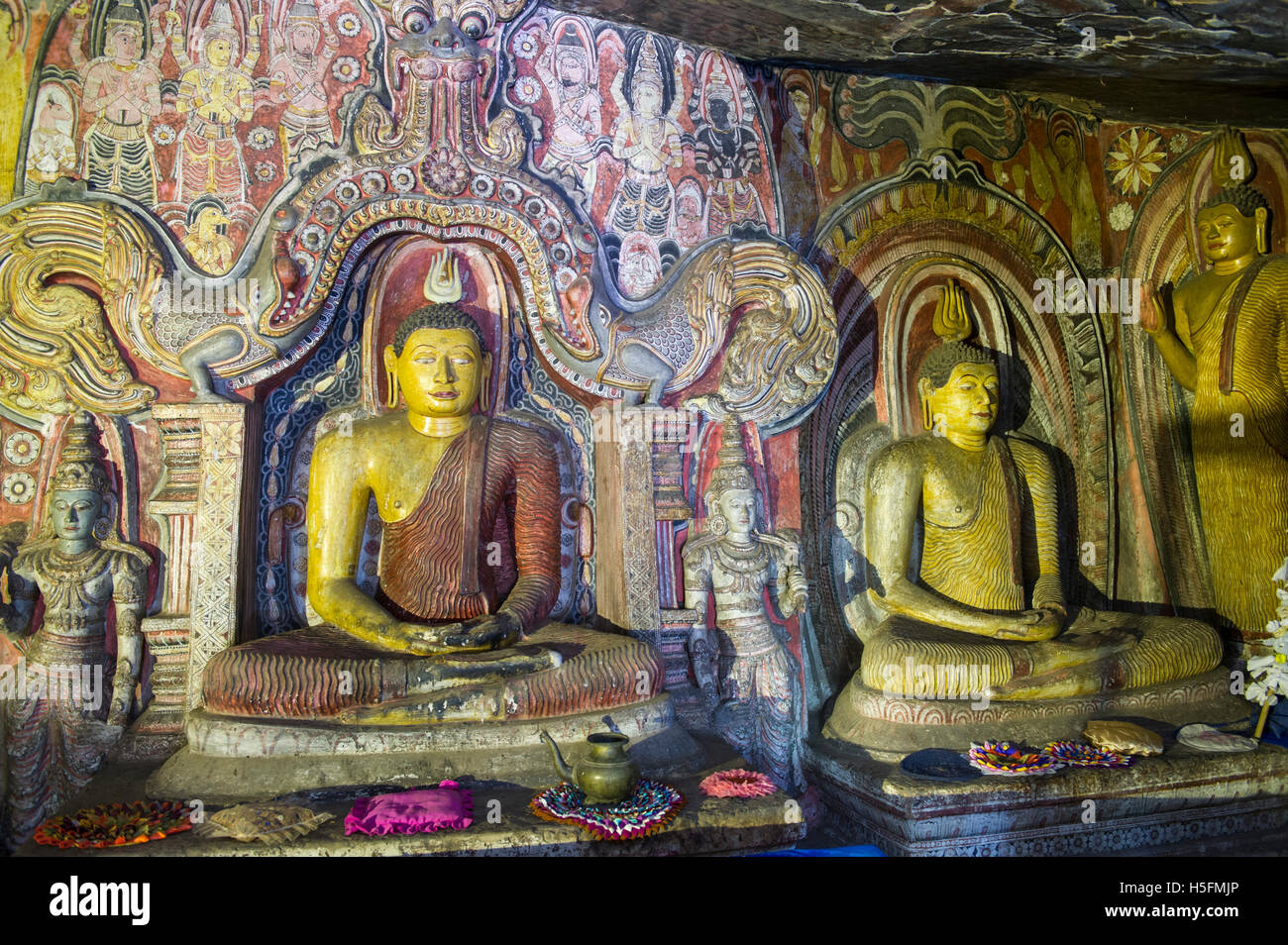 Interior of an ancient cave temple with Dambulla style paintings ...