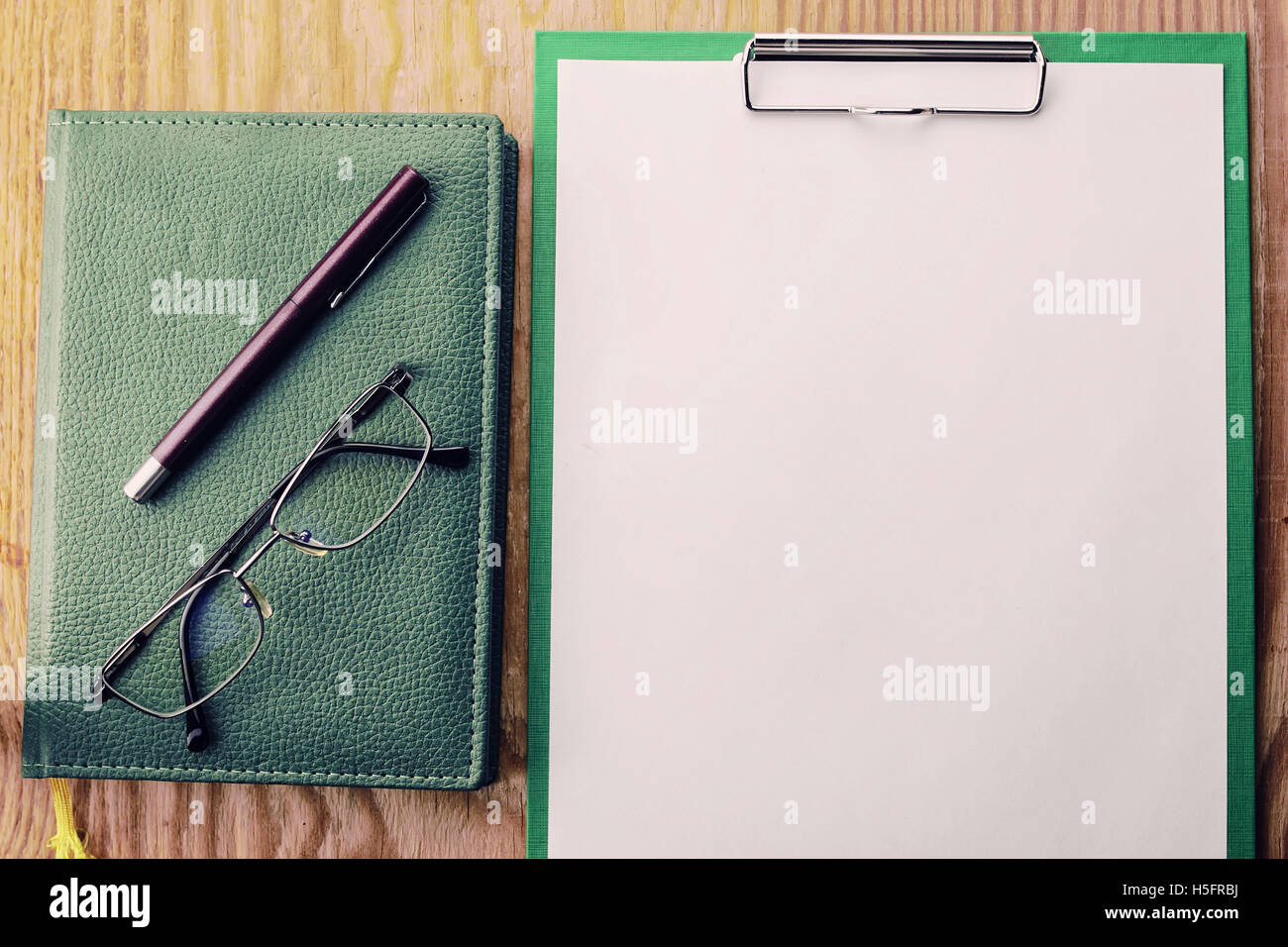 toned background notepad pen Stock Photo - Alamy