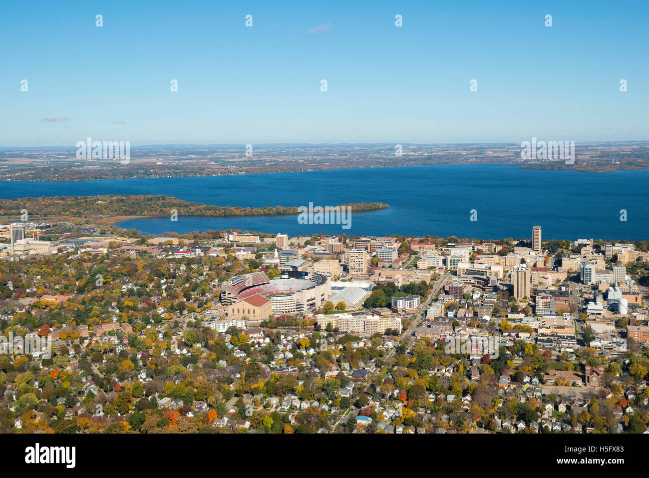 An aerial view of Madison, Wisconsin,  the University of Wisconsin-Madison's Camp Randall Stadium, surrounded by Lakes Mendota ( Stock Photo