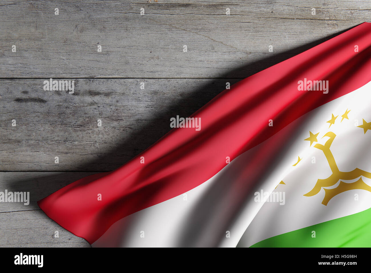 3d rendering of Republic of Tajikistan flag waving on wooden background Stock Photo
