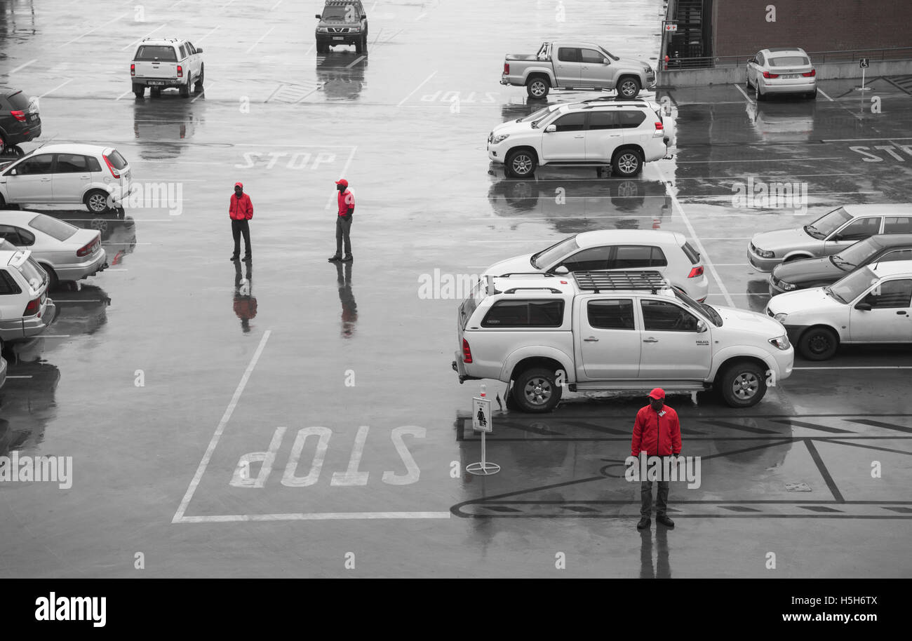 Overhead view of car guards at work on a rainy, overcast morning Stock Photo
