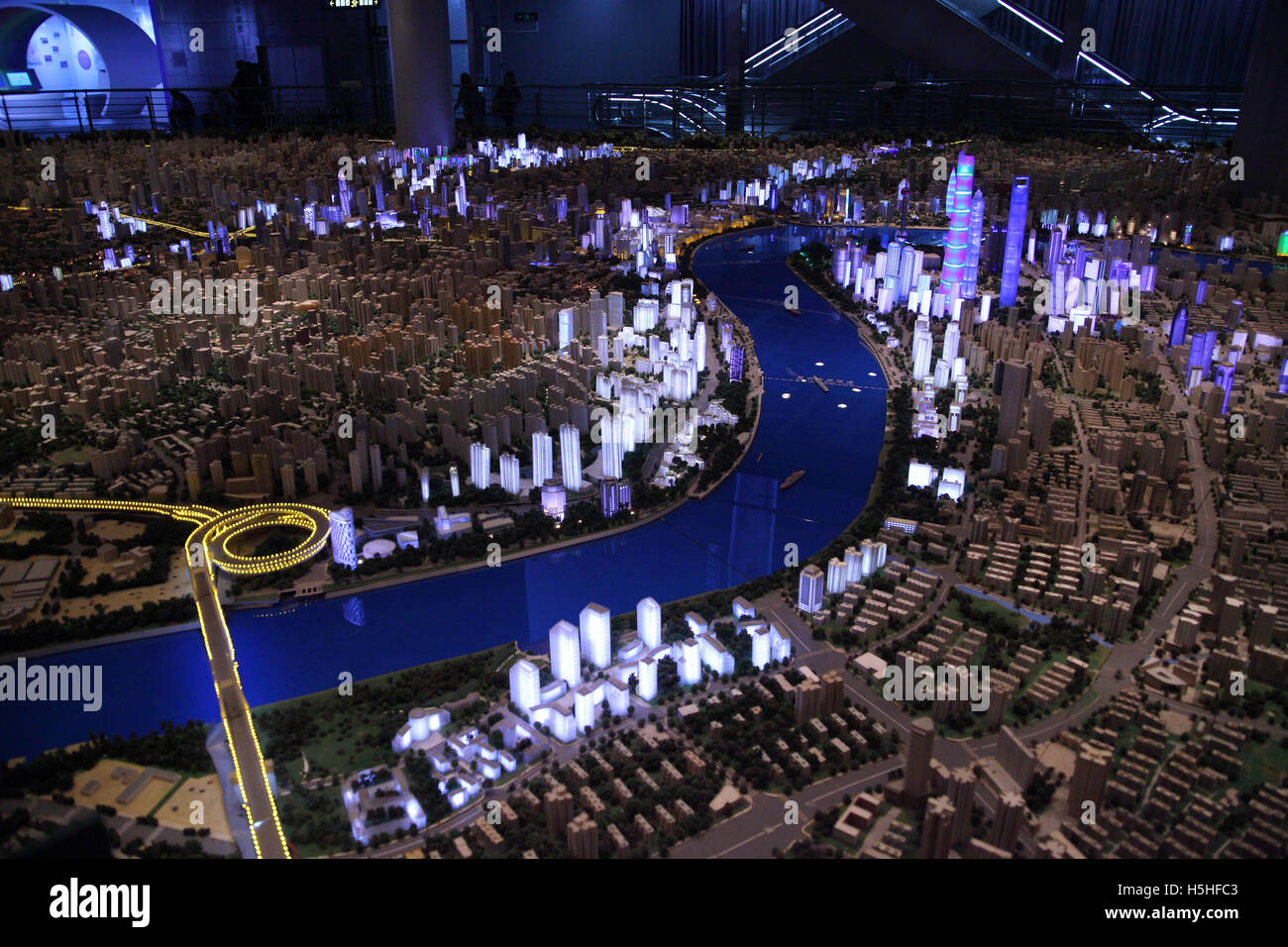 A mini model of the city of Shanghai as it looks in the evening, it is in the Urban Planning Exhibition Hall.  Shanghai, China. Stock Photo