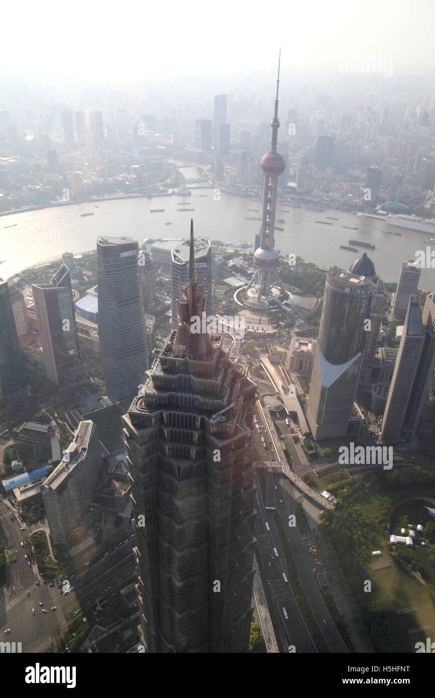 The Jin Mao Tower,  the Oriental Pearl TV Tower and other high rise buildings in Pudong and the Huangpu River seen behind. Stock Photo