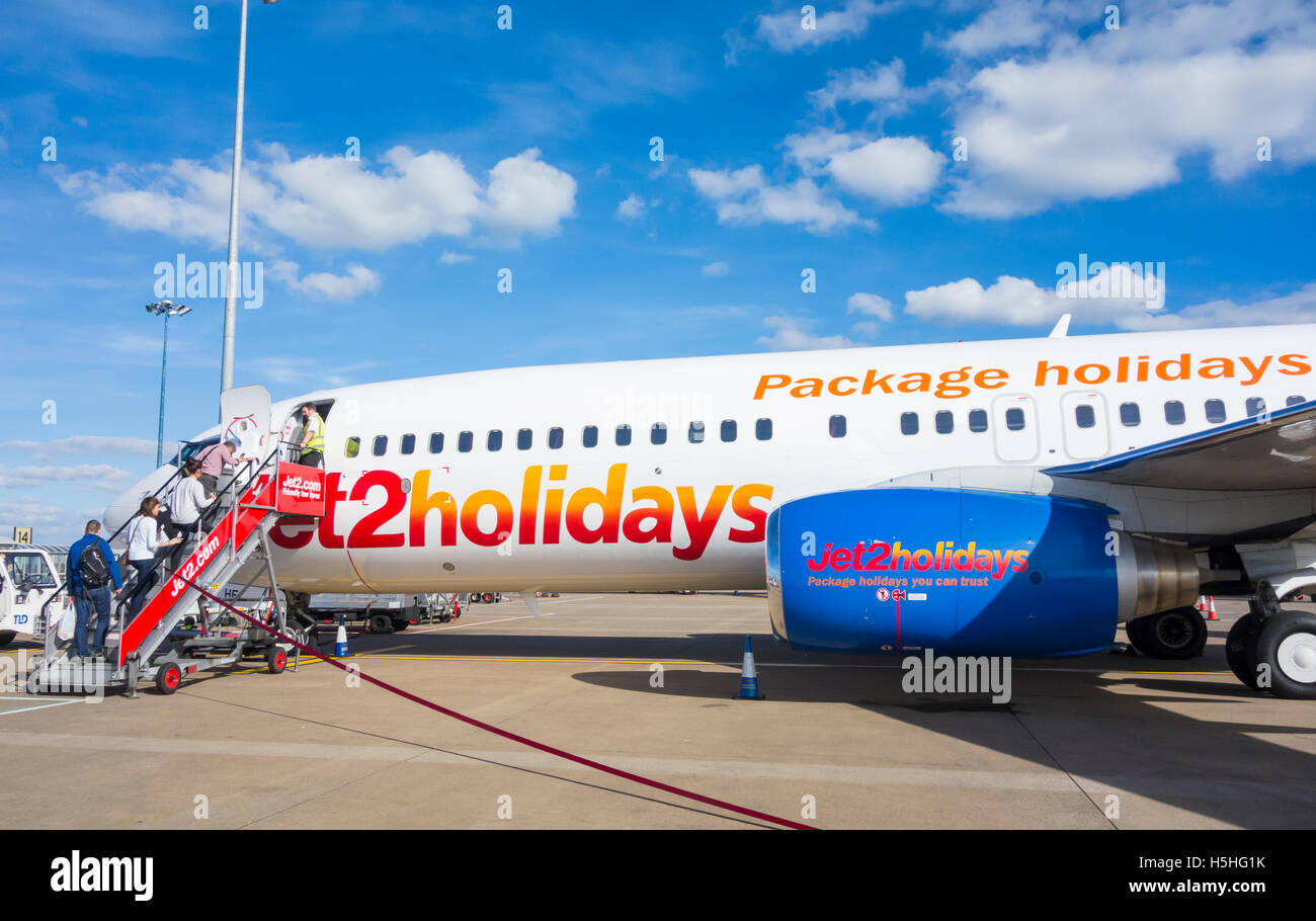 Passengers boarding flight at Leeds/Bradford airport. England