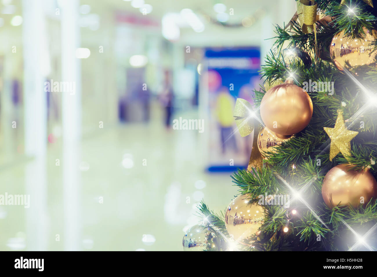 Christmas tree with gold decoration in shopping mall.Christmas