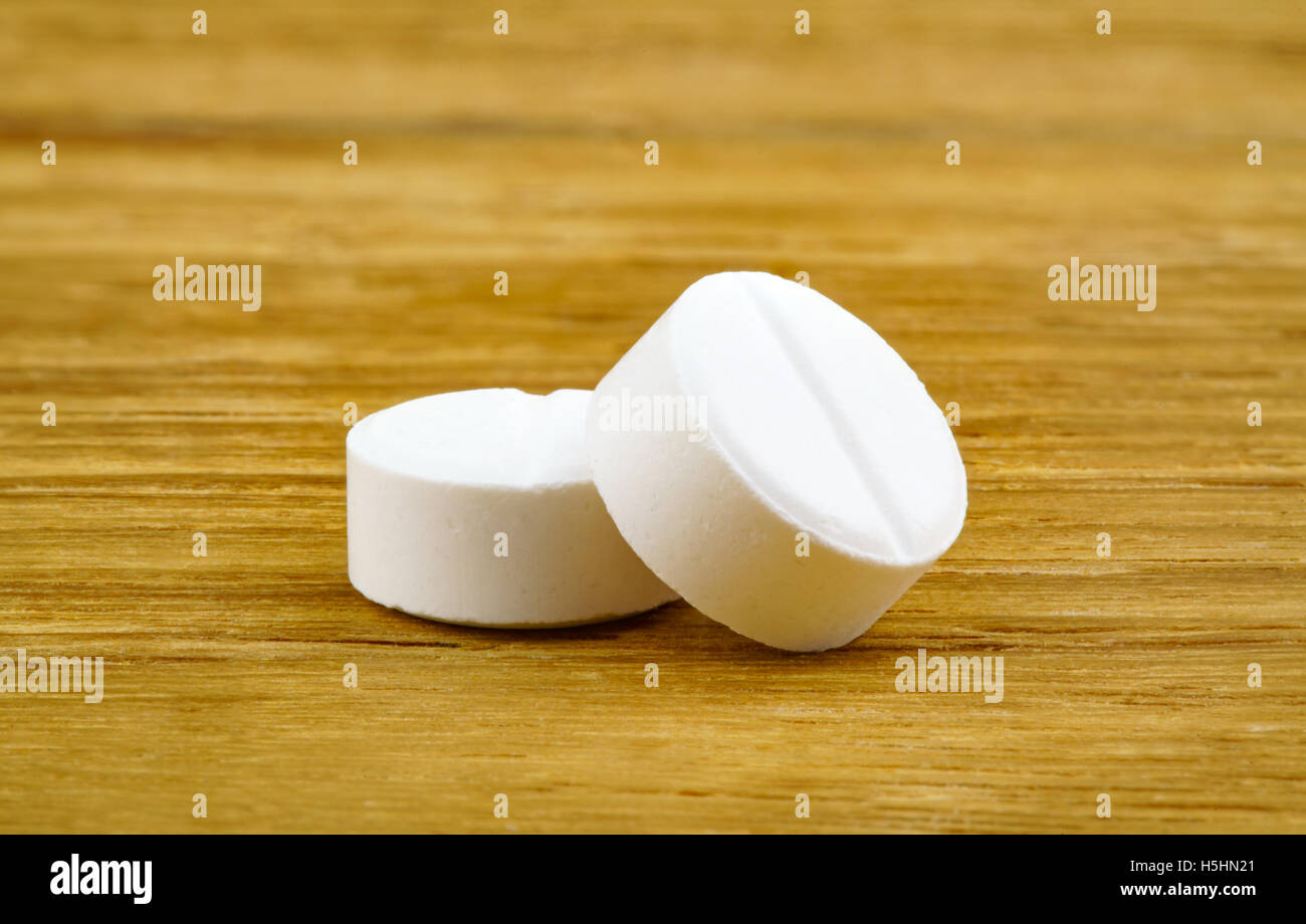 White pills of medicine on white background Stock Photo