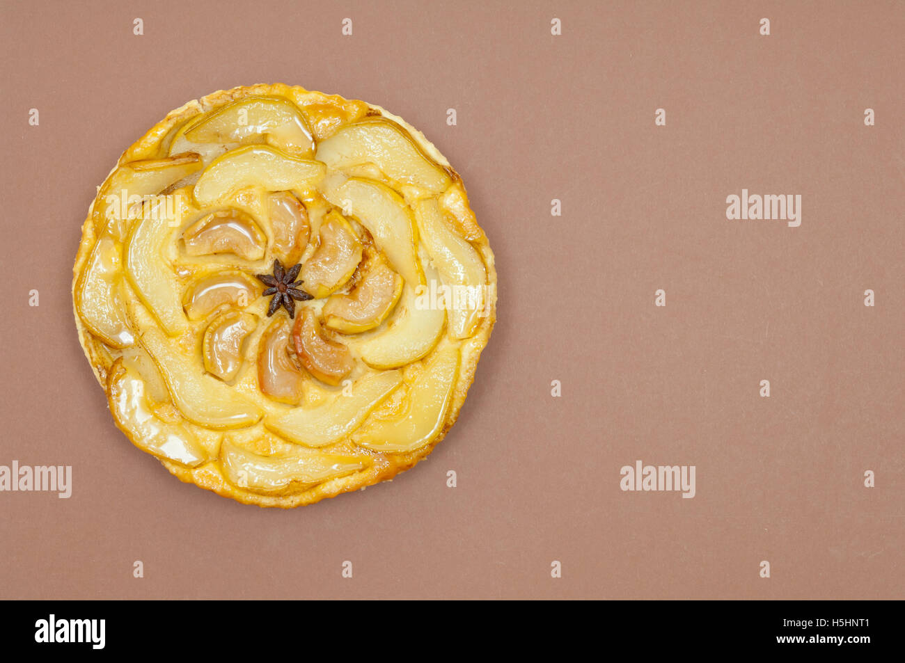 Tarte tatin, apple tart, pear tart on paper background with copy space Stock Photo