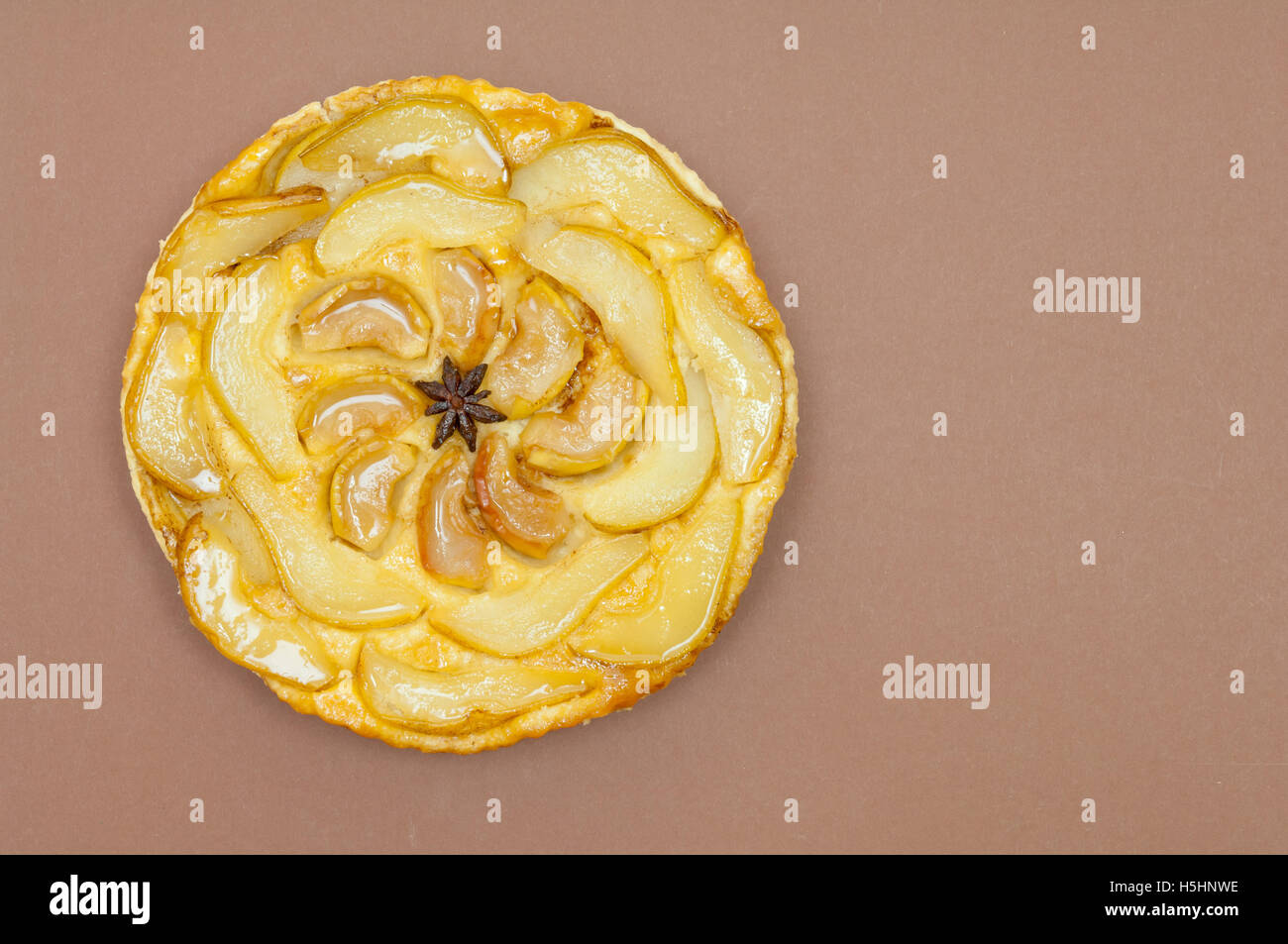 Tarte tatin, apple tart, pear tart on paper background with copy space Stock Photo