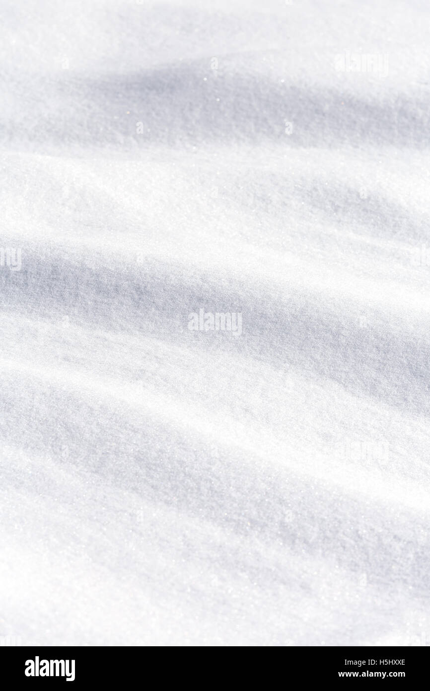 Wavy surface of pure white snow Stock Photo