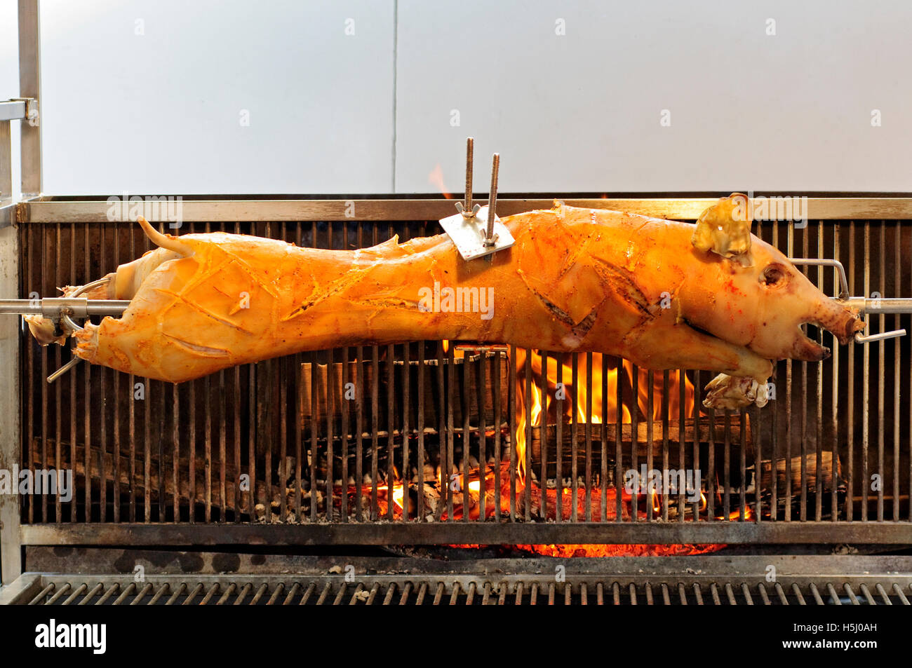 Germany, Bavarian, Street Food, Pig Roasting on a Spit Stock Photo