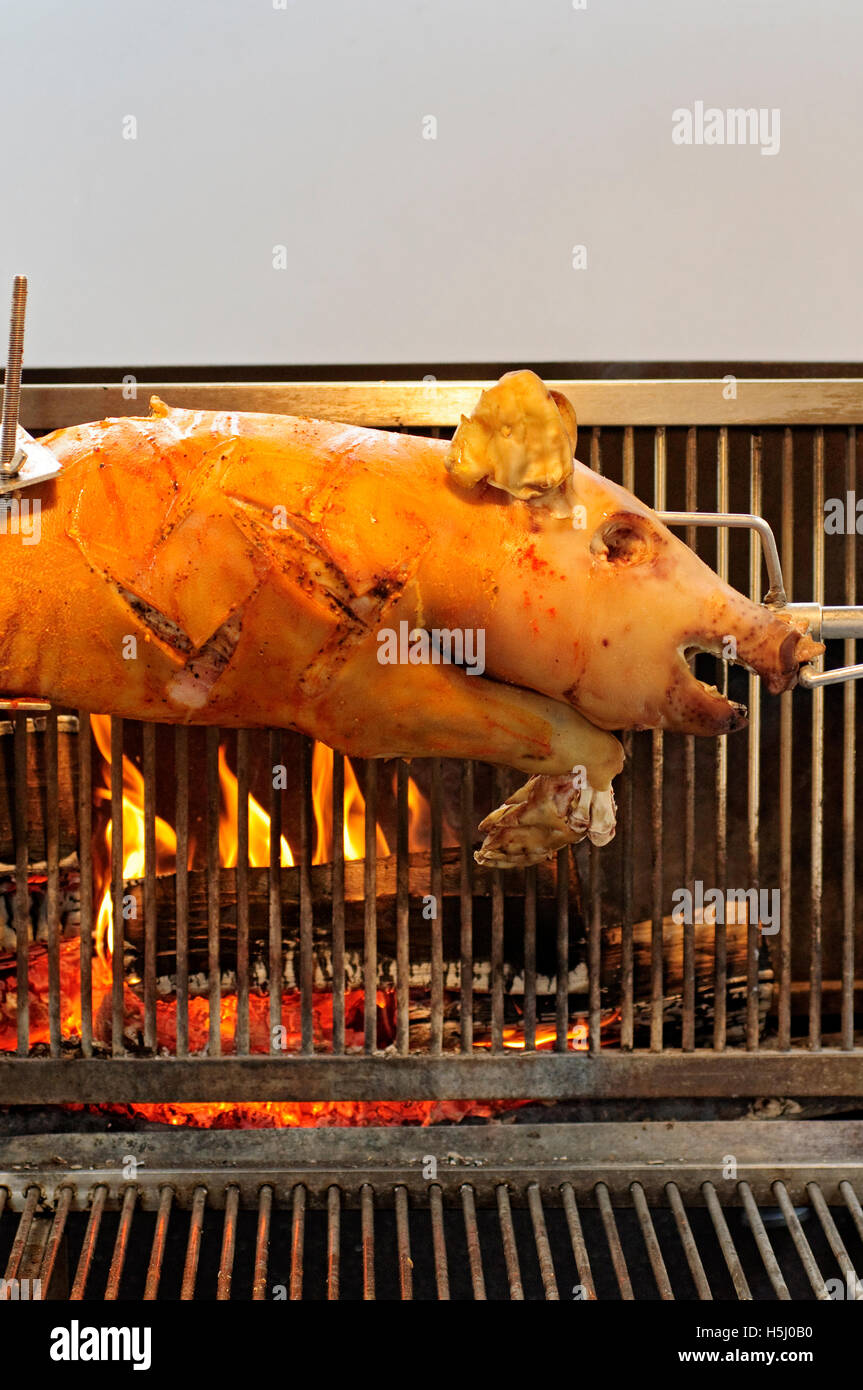 Germany, Bavarian, Street Food, Pig Roasting on a Spit Stock Photo
