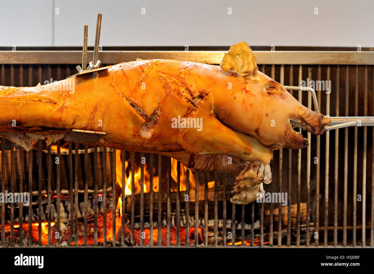 Germany, Bavarian, Street Food, Pig Roasting on a Spit Stock Photo