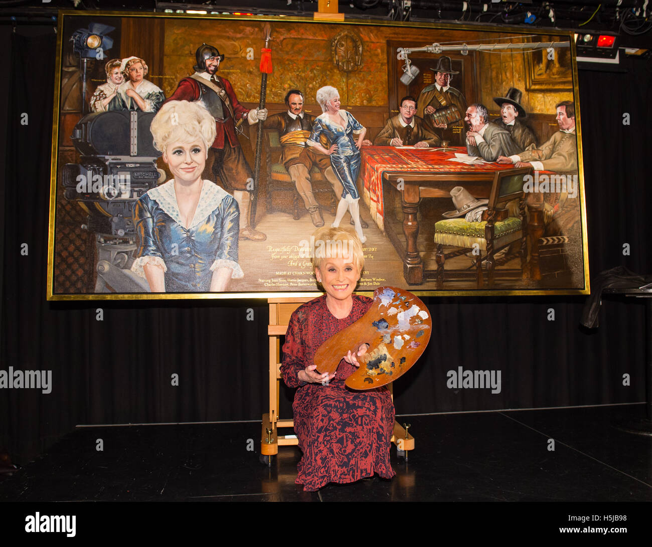 Dame Barbara Windsor unveils the painting 'And When Did You Last See Your Feet?' by artist Nick McCann, a tribute to the Carry On films, at the Comedy Store in London. Stock Photo