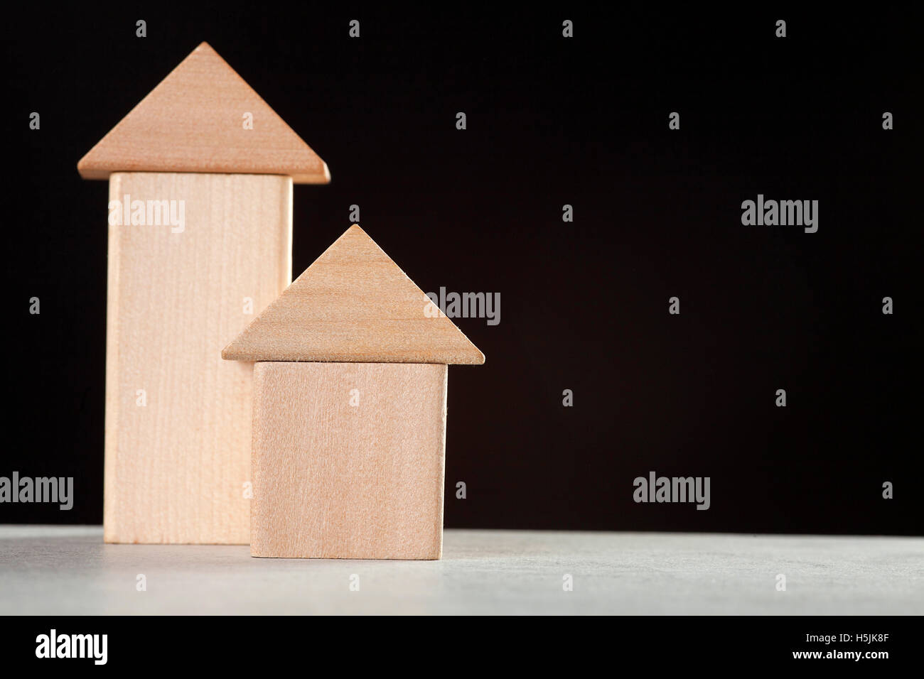 wooden blocks house on black background Stock Photo - Alamy