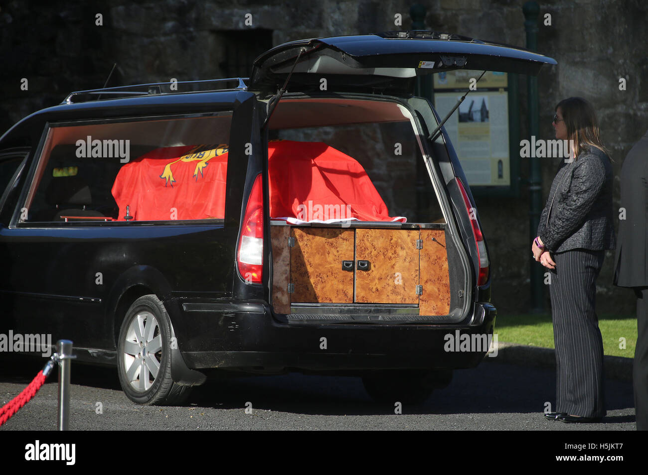 Anthony Foley's wife Olive looks at the coffin of her husband as its