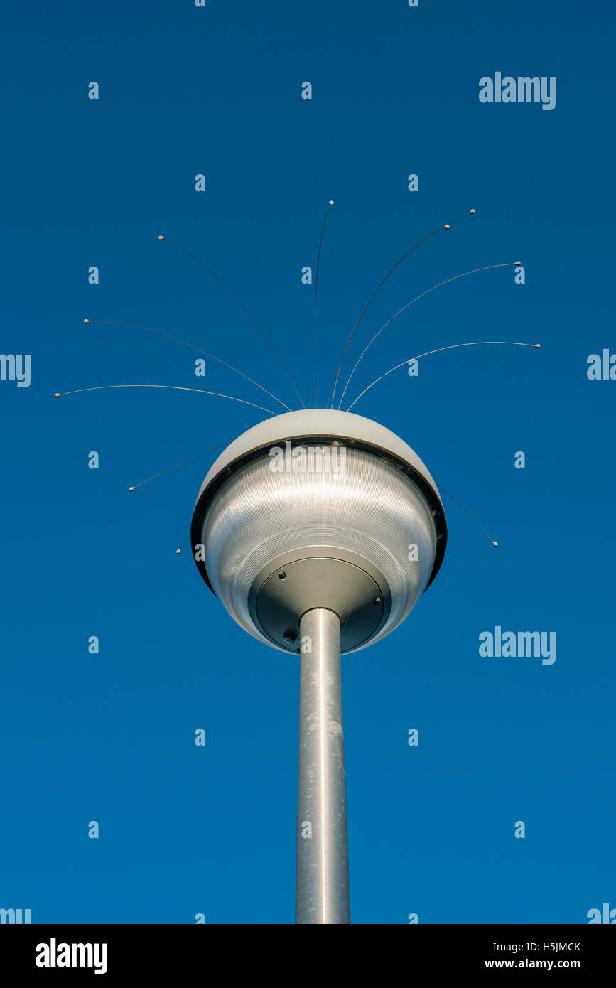 Modern lamp post against a blue sky Stock Photo
