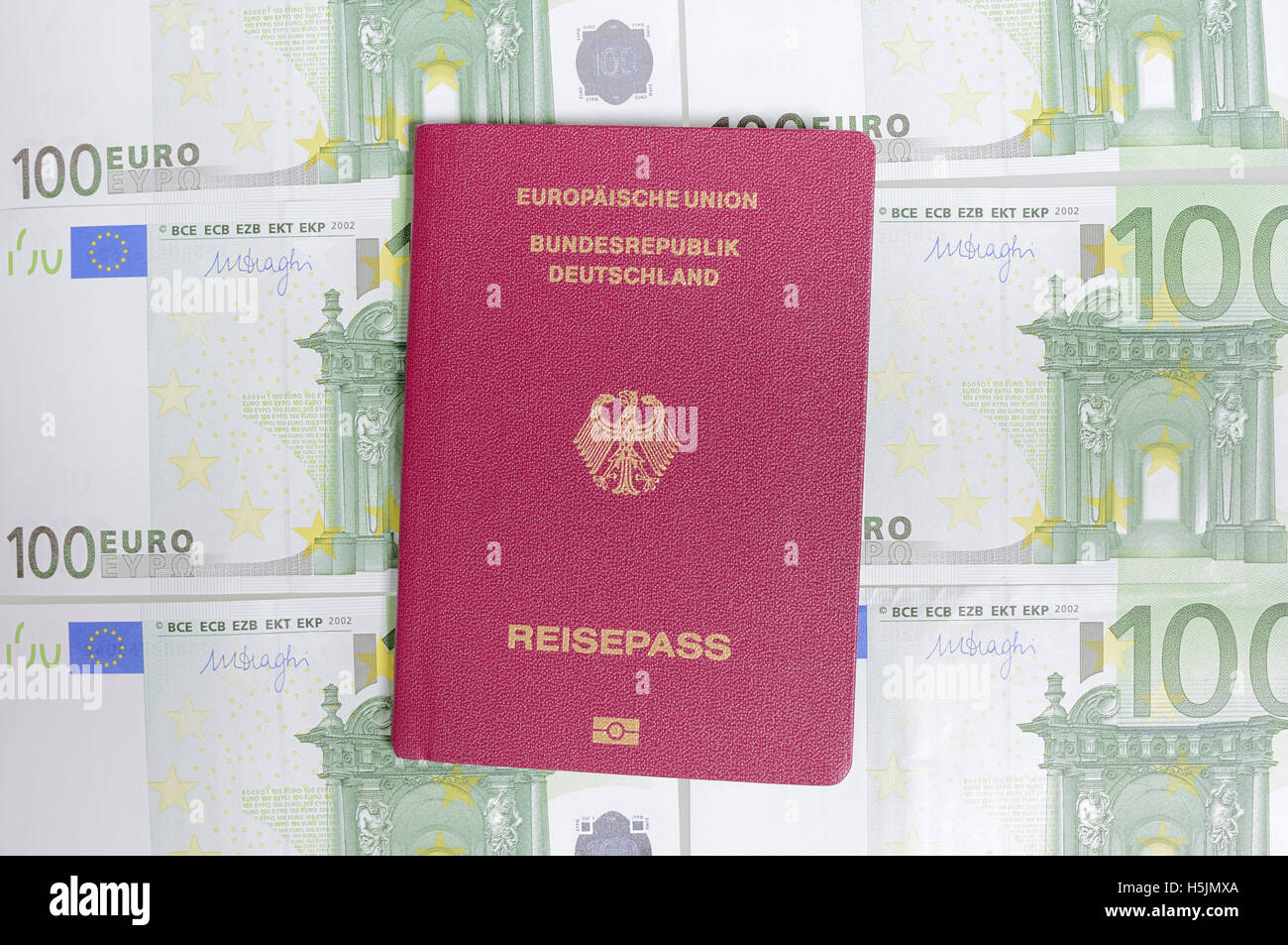 German Passport and hundred euro bills Stock Photo