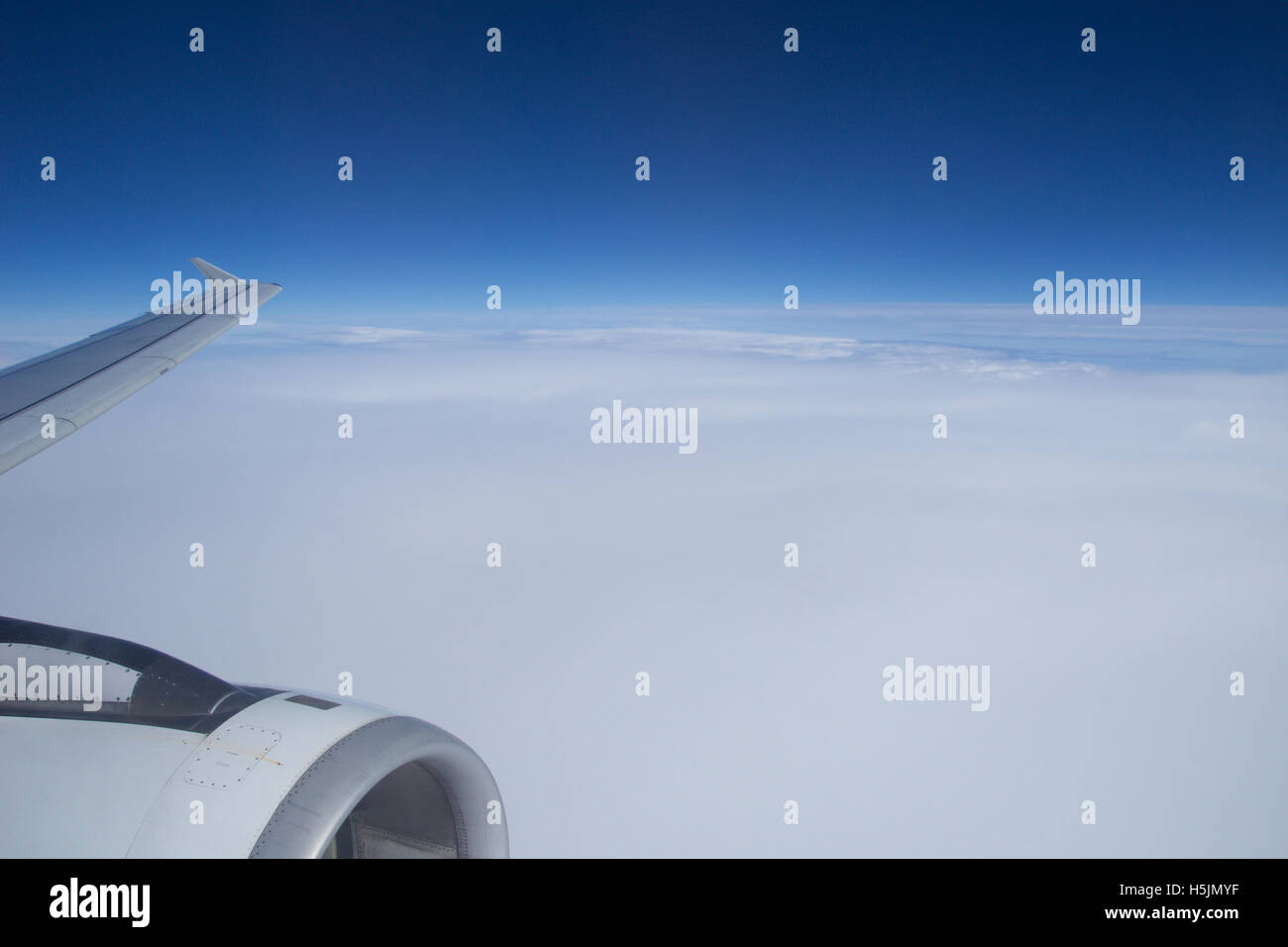 AUSTRIA - October 2016: Clouds and sky as seen through window of an aircraft Stock Photo