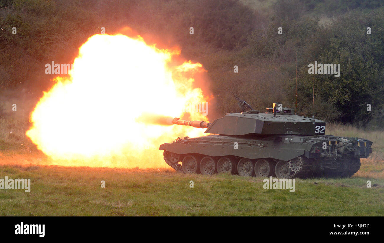 A Challenger 2 tank fires live ammunition during an army combined arms manoeuvre demonstration at Larkhill Camp, Wiltshire. Stock Photo