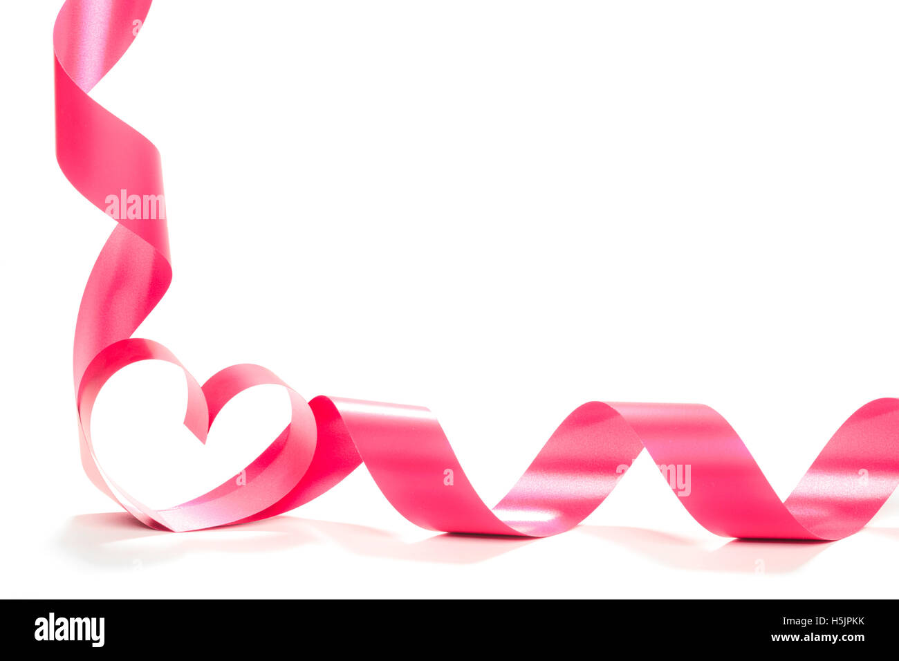 red heart ribbon isolated on white background Stock Photo - Alamy