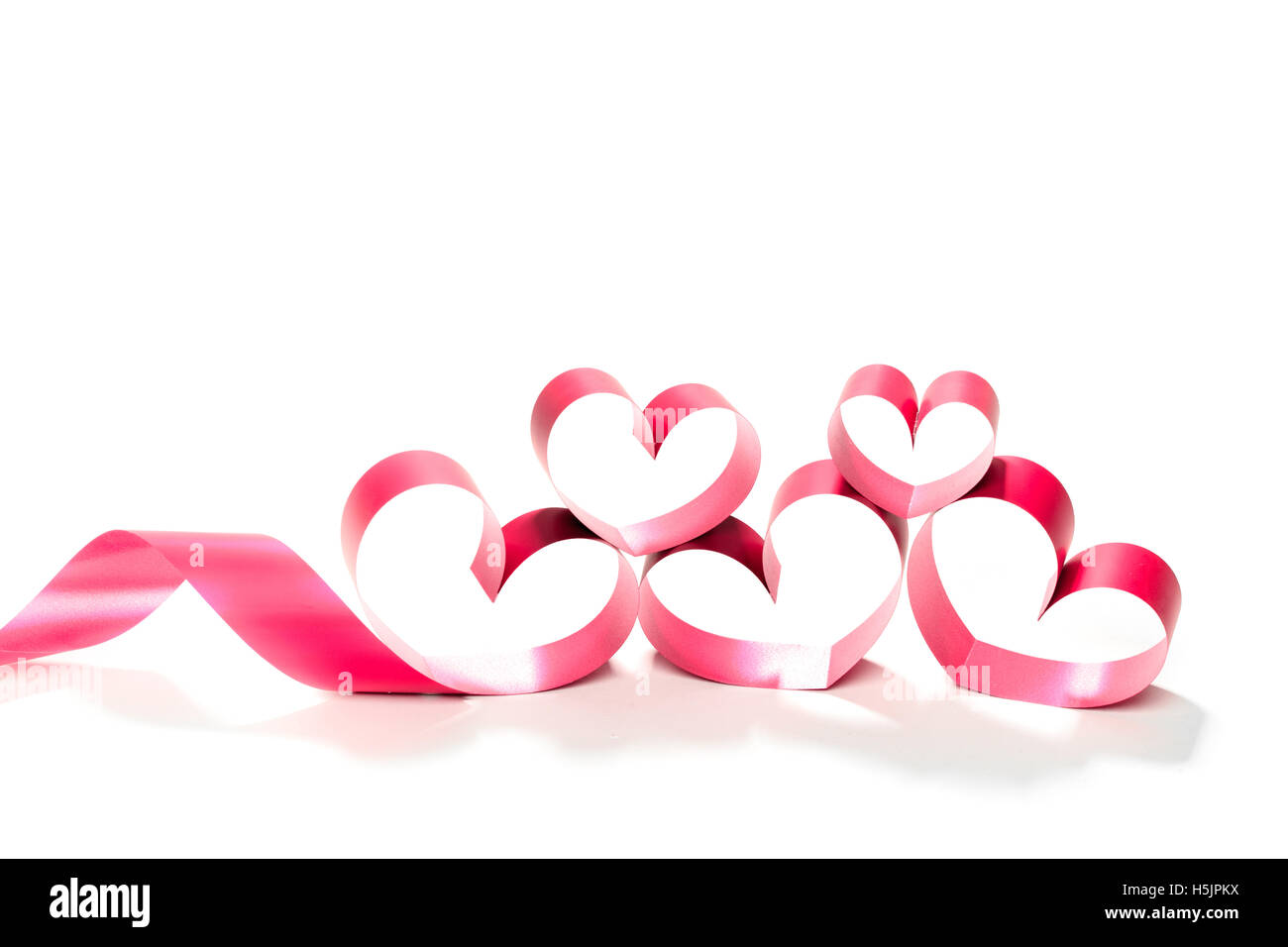 red heart ribbon isolated on white background Stock Photo - Alamy