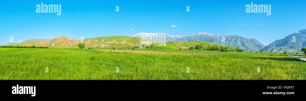 The agriculture lands of Qashqadaryo Region of Uzbekistan with amazing view on Gissar range of Pamir-Alay mountains Stock Photo