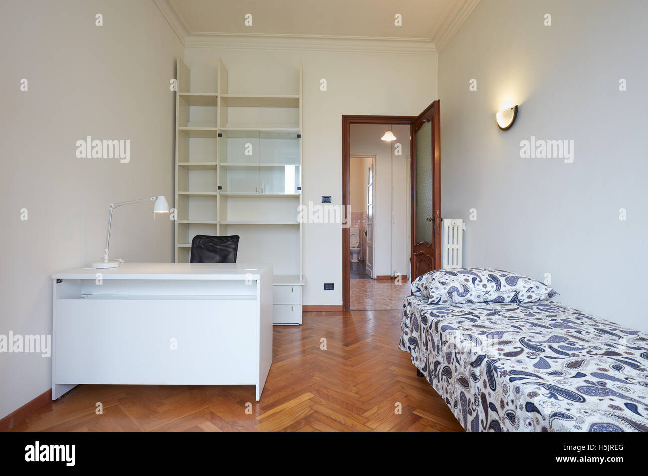 Bedroom interior with single bed in normal apartment Stock Photo