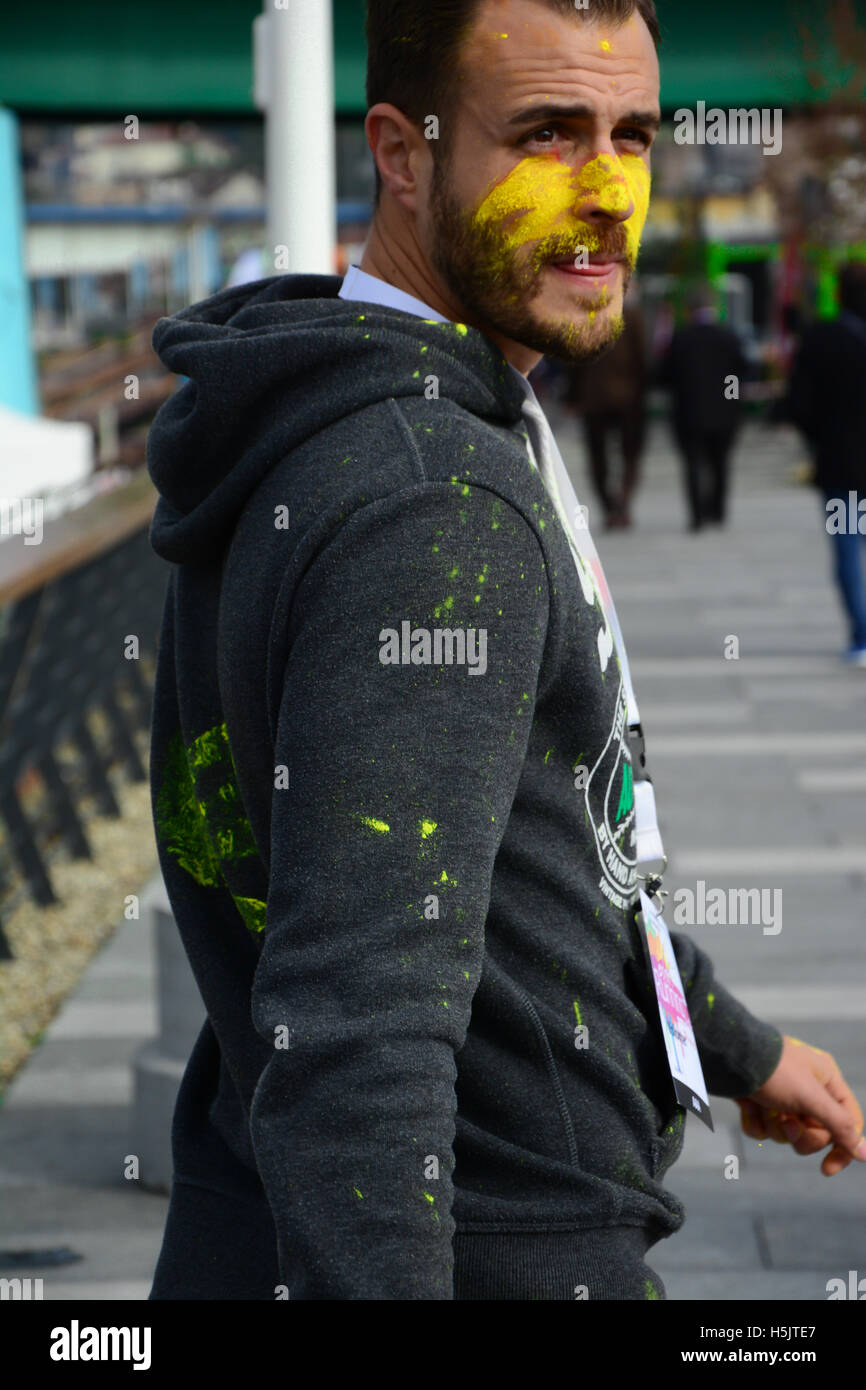 Handsome guy at color running race. Stock Photo