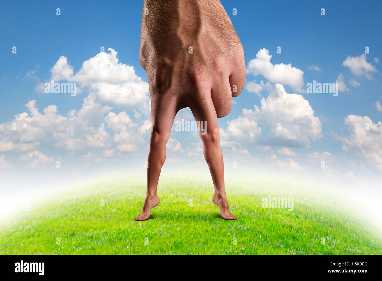 Male hand with legs Stock Photo