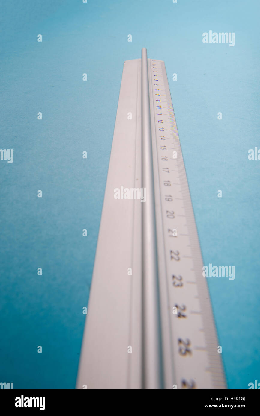 aluminum ruler on blue background. High resolution Stock Photo - Alamy